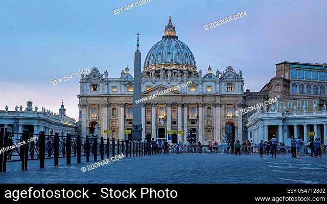 low angle view at dusk of st peter's basilica in vatican city