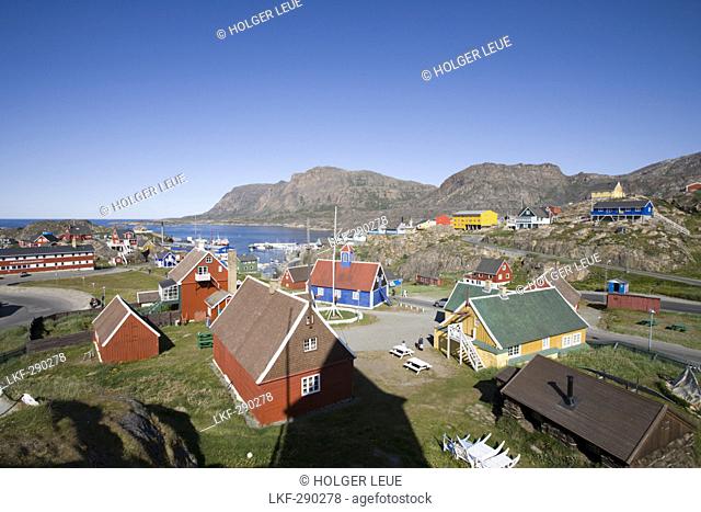 Wooden houses on the waterfront under blue sky, Sisimiut, Kitaa, Greenland