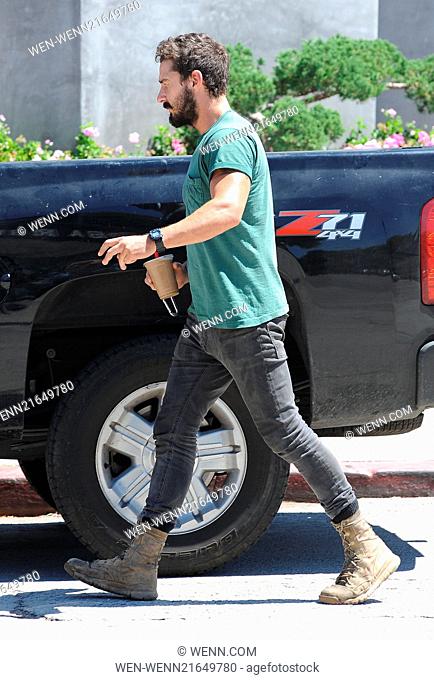 Shia LaBeouf wearing an old plain green t-shirt and black skinny jeans with scruffy boots goes out for an ice coffee Featuring: Shia LaBeouf Where: Los Angeles