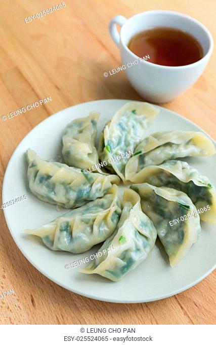 Chinese meat dumpling with a cup of tea