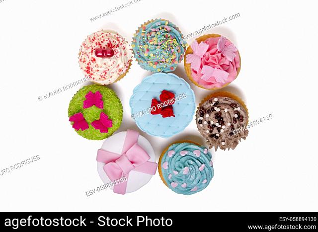 Close up view of original and creative cupcake designs isolated on a white background