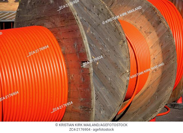 Huge orange cable drums for optic fibre connections