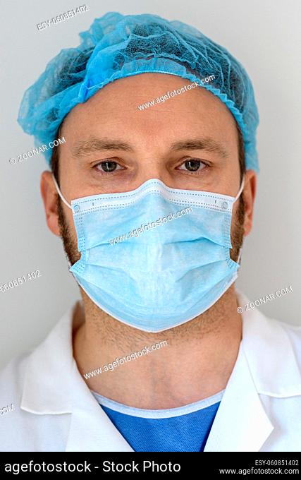 Portrait of a doctor with protective face mask in the hospital