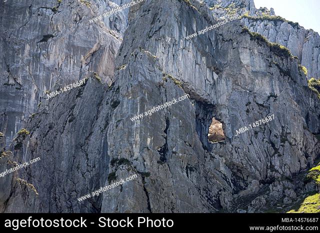 Hole in a rock face, near Stripsenjoch or Stripsenjochhaus, Kaisergebirge, Tyrol, Austria