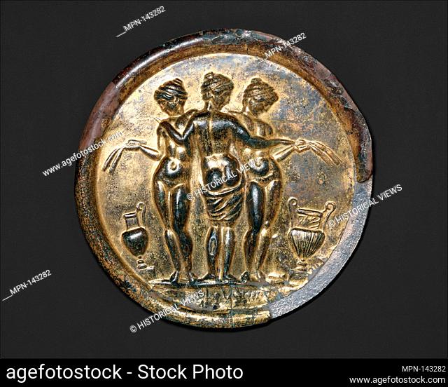 Gilded bronze mirror with the Three Graces. Period: Mid-Imperial, Antonine; Date: mid-2nd century A.D; Culture: Roman; Medium: Bronze, silver, gold