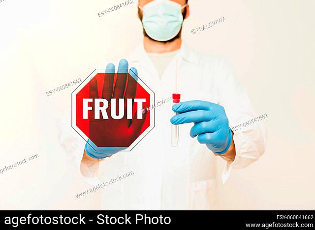 Hand writing sign Fruit, Business idea sweet and fleshy product of a tree or other plant that contains seed Doctor Explaining Laboratory Test Result
