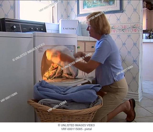 Mature woman doing laundry