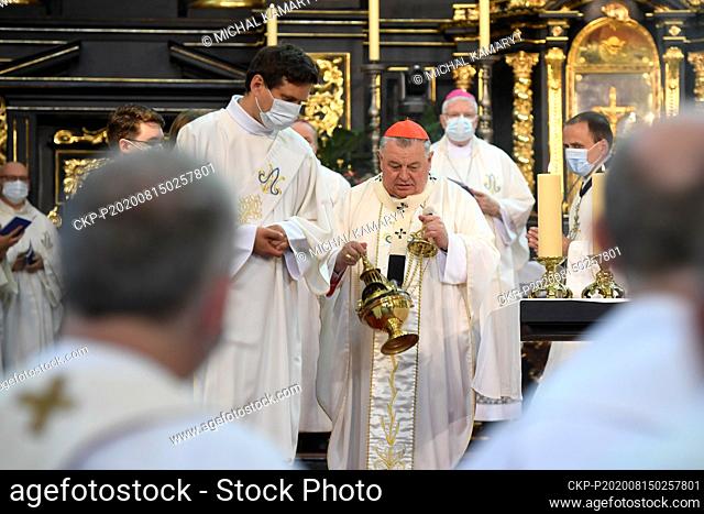 Prague Archbishop Cardinal Dominik Duka, center, celebrates a divine service in the Church of our Lady before Tyn in Prague, Czech Republic, August 15, 2020