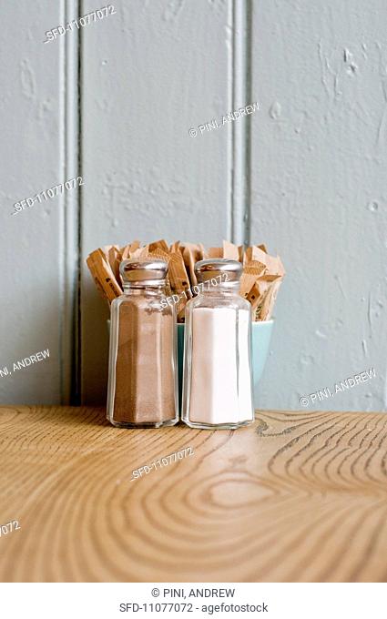 Salt, pepper and sugar on a table in a restaurant