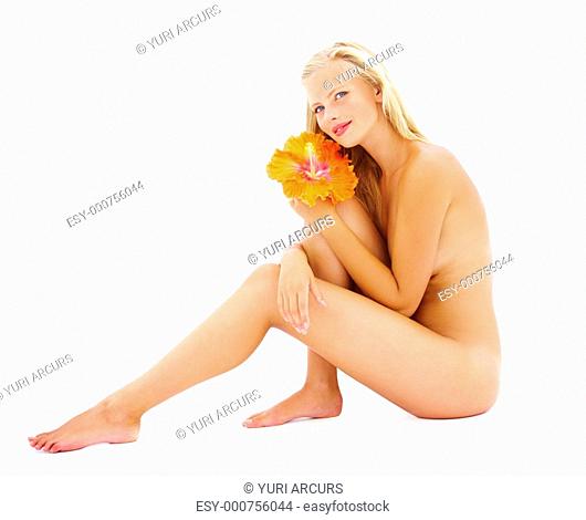 Full length portrait of a beautiful young woman with flower in hand