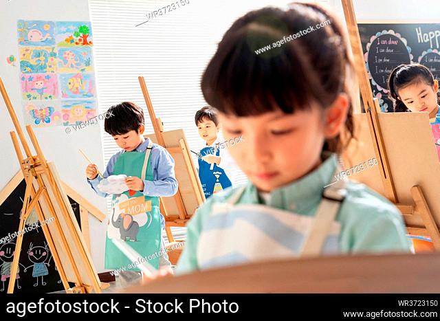 Children learning to paint