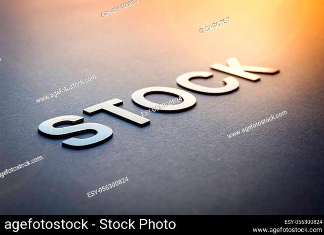 Word stock written with white solid letters on a board