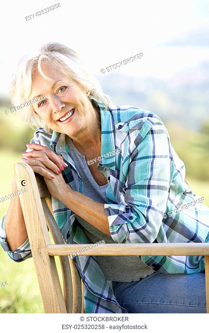 Senior woman sitting outdoors