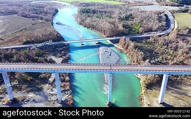 Bridge and Aragon river. Saragossa province, Aragon, Spain. Europe. Aerial view. 4K