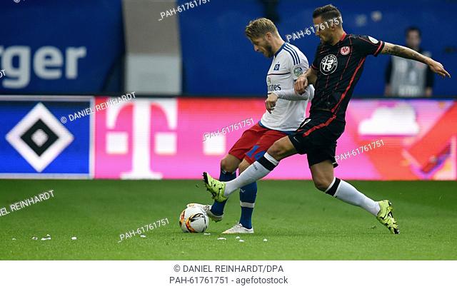 Hamburg's Aaron Hunt (l) and Frankfurt's Haris Seferovic vie for the ball during the German Bundesliga soccer match between Hamburg SV and Eintracht Frankfurt...