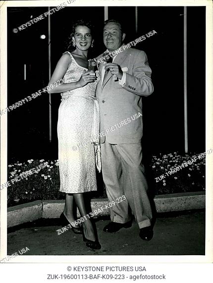 1959 - Beauteous Abbe Lane (Mrs. Cuagt) and her famous bandleader husband, rhumba King Xavier Cugat, look appropriately happy as they munch eskimo pies from one...
