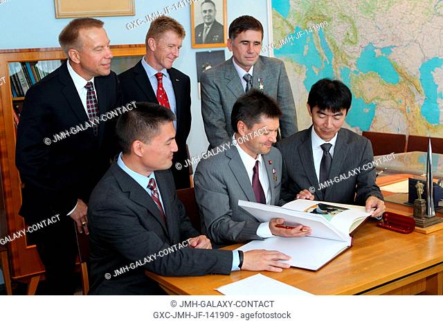 At the Gagarin Cosmonaut Training Center in Star City, Russia, the Expedition 4445 prime and backup crewmembers prepare to sign a ceremonial book in the Gagarin...