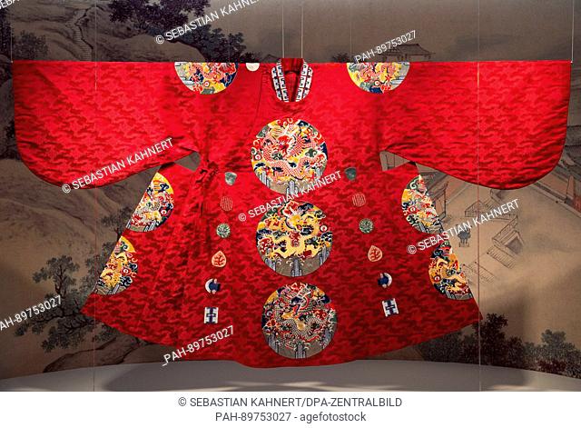A replica of a festive garment of a Chinese emperor of the Ming dynasty made from satin is on display in the exhibition 'The City Wall of Nanjing - The Ming...