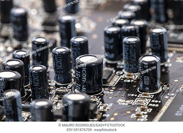 Close view of the main computer circuit board capacitors