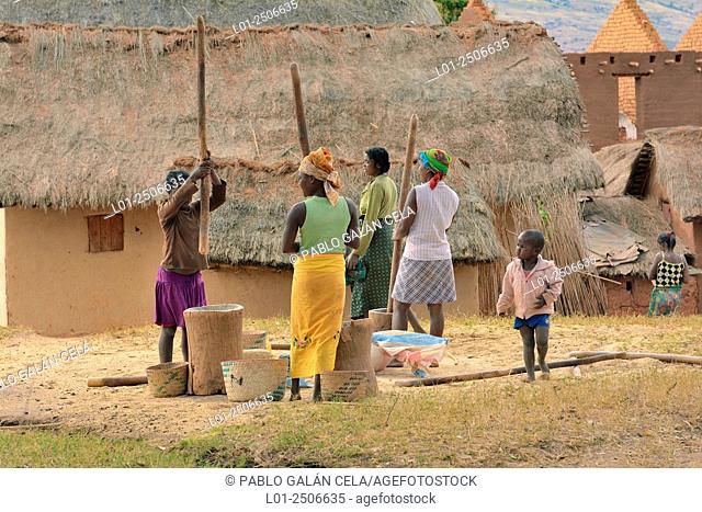 Women preparing food in a small village in Andringitra National Park, Madagascar