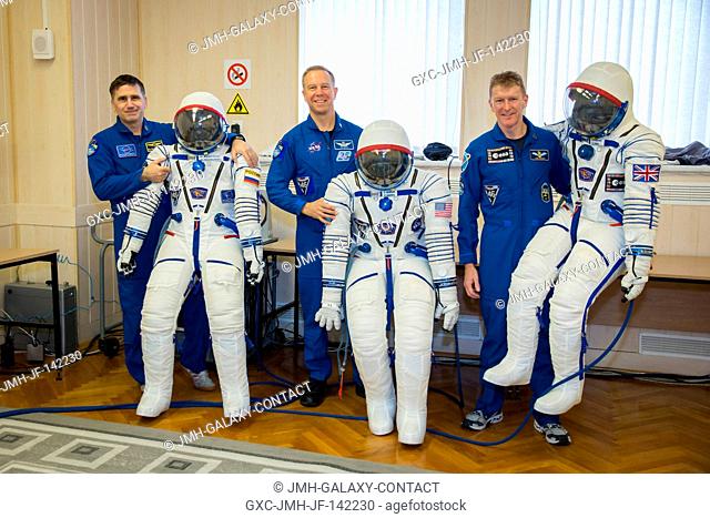 In the Integration Facility at the Baikonur Cosmodrome in Kazakhstan, Expedition 46-47 crewmember Tim Peake of the European Space Agency suits up during a fit...