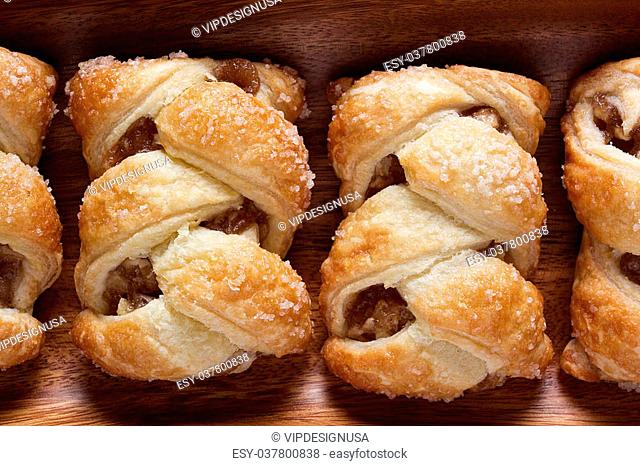 Apple strudel on a wooden plate. Culinary pastries