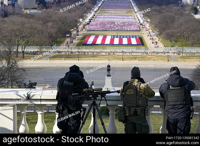 Law enforcement personnel monitoring surrounding areas during the 59th Presidential Inauguration at the U.S. Capitol in Washington, Wednesday, Jan