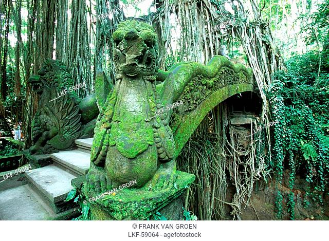 statue of a dragon in the monkey forrest, bridge, ubud, bali, indonesia