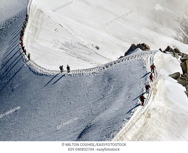 Trekkers on Aiguille Du Midi, in the french alps