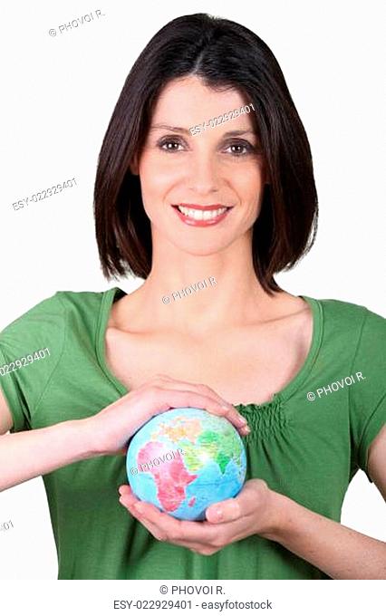 Woman holding small globe
