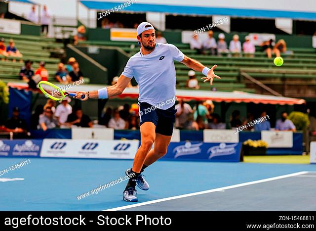 MELBOURNE, AUSTRALIA - JANUARY 15, 2020: Matteo Berrettini (ITA) hits a forehand to Marc Polmans (AUS) at the AgBioEn Kooyong Classic on Day 2 in Melbourne...