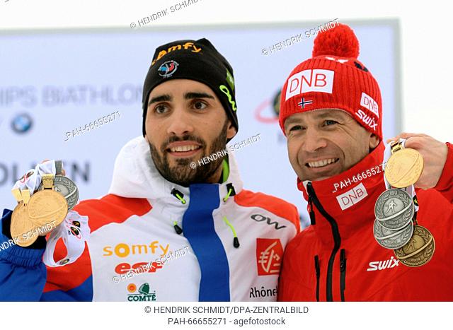 Martin Fourcade (L) of France and Ole Einar Bjoerndalen of Norway show their medals after the Men 15km Mass Start competition at the Biathlon World...