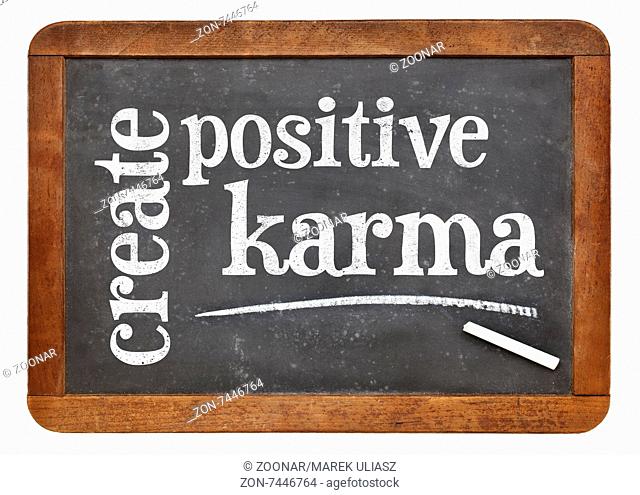 create positive karma - motivational text on a vintage slate blackboard