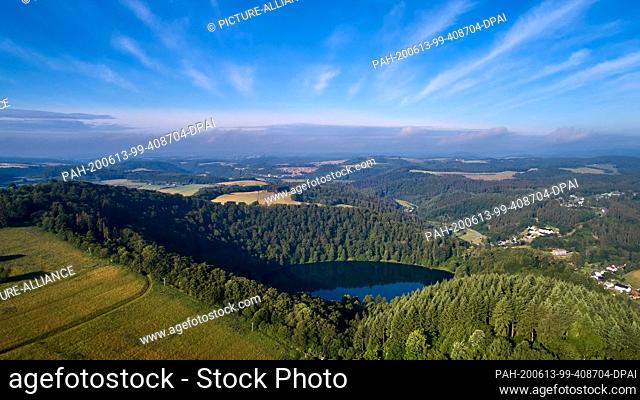 12 June 2020, Rhineland-Palatinate, Gemünden: The Gemündener Maar, aerial view with a drone. Researchers have measured that the earth rises there and is also...