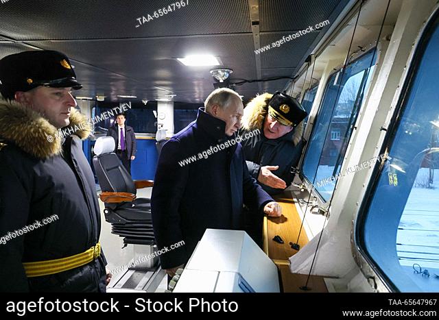 RUSSIA, ARKHANGELSK REGION - DECEMBER 11, 2023: Russia's President Vladimir Putin (C) and Nikolai Yevmenov (R), commander-in-chief of the Russian Navy