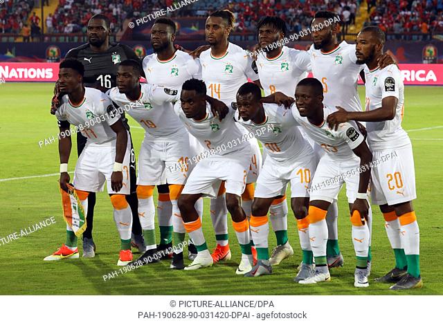 28 June 2019, Egypt, Cairo: Ivory coast players pose for the team photo prior to the start of the 2019 Africa Cup of Nations Group D soccer match between...