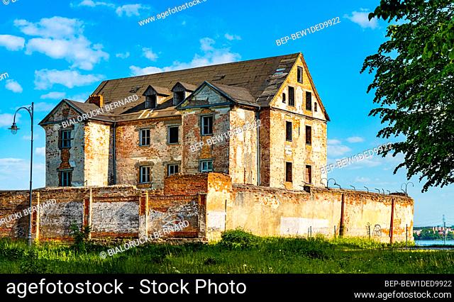 Elk, Poland - June 2, 2021: Ruins of historic Elk castle of Teutonic Order - Zamek w Elku - at Zamkowa street on shore of Jezioro Elckie lake