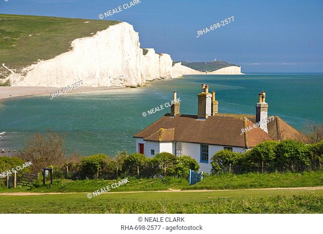 The Seven Sisters chalk cliffs, the coastguard cottages on Seaford Head, South Downs Way, South Downs National Park, East Sussex, England, United Kingdom