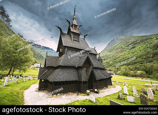 Borgund, Norway. Famous Landmark Stavkirke An Old Wooden Triple Nave Stave Church In Summer Day. Ancient Old Wooden Worship In Norwegian Countryside Landscape