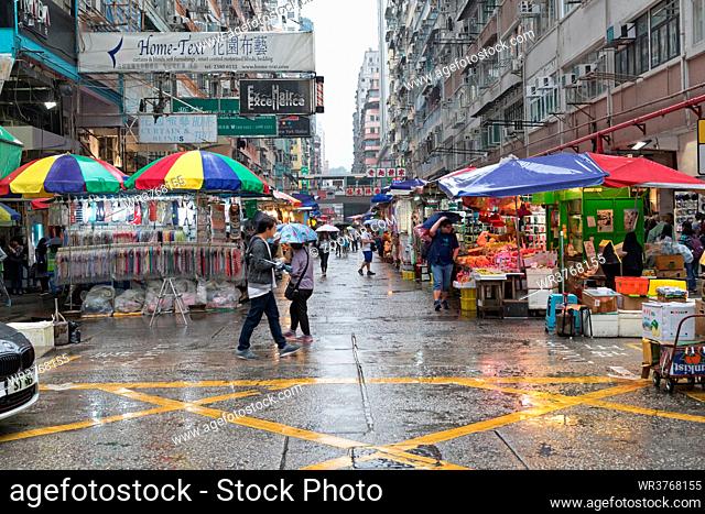 Kowloon, Hong Kong - April 23, 2017: Rainbow Parasols at Street Market Rainy Day in Kowloon, Hong Kong