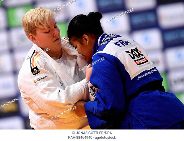 Jasmin Kuelbs (white, Germany) and Eva Bisseni (blue, France) in action during the women's up to 78 kg body weight competition at the Judo Grand Prix in the...