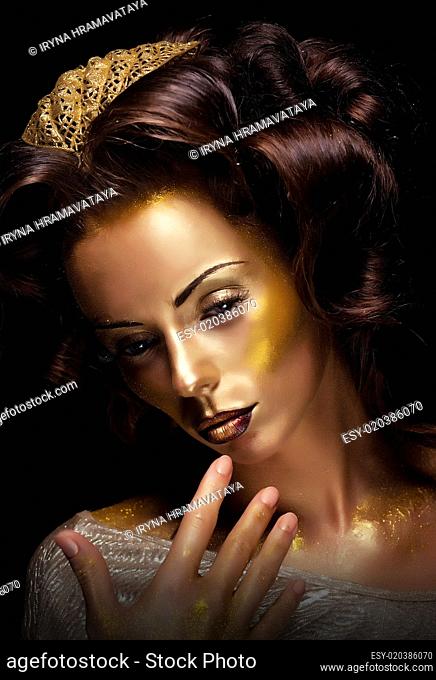 Theater. Actress acting - bright golden makeup