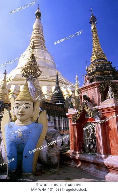 The Shwedagon Pagoda (Great Dagon Pagoda or Golden Pagoda); gilded stupa located in Yangon, Myanmar. The 326-foot-tall pagoda, is situated on Singuttara Hill