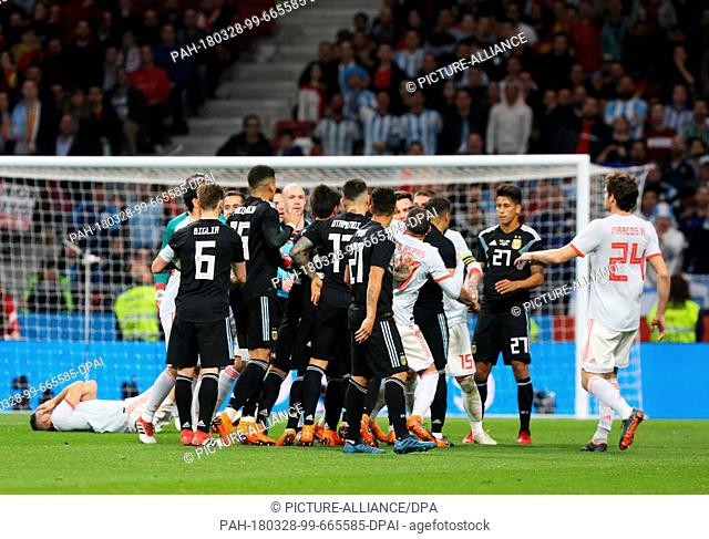 27 March 2018, Spain, Madrid, Wanda Metropolitano Stadium: Soccer, Friendly International,  Spain vs Argentina: Spain's players argue with Argentinian players