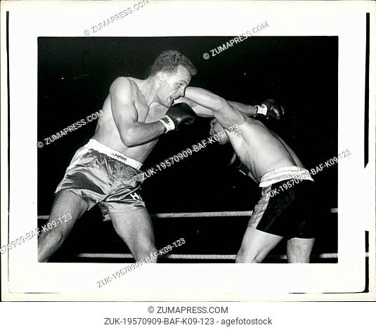 Sep. 09, 1957 - Double Miss London: Challenger Henry Cooper (left) to Bellingham, and the holder Joe Erskine of Wales (right) Entwine Arms