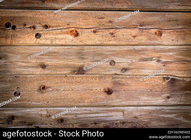 Rustic wood planks background with nice studio lighting and elegant vignetting to draw the attention