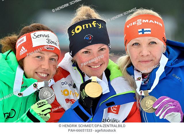 Second placed Laura Dahlmeier (L-R) from Germany, winner Marie Dorin-Habert from France and third placed Kaisa Makarainen from Finland show their medals for the...