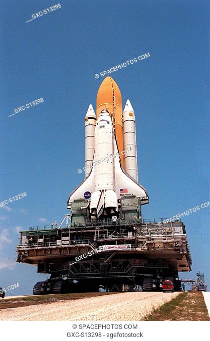 04/26/1999 -- The Space Shuttle Discovery, atop the mobile launcher platform and crawler-transporter, begins the climb up the ramp to Launch Pad 39B