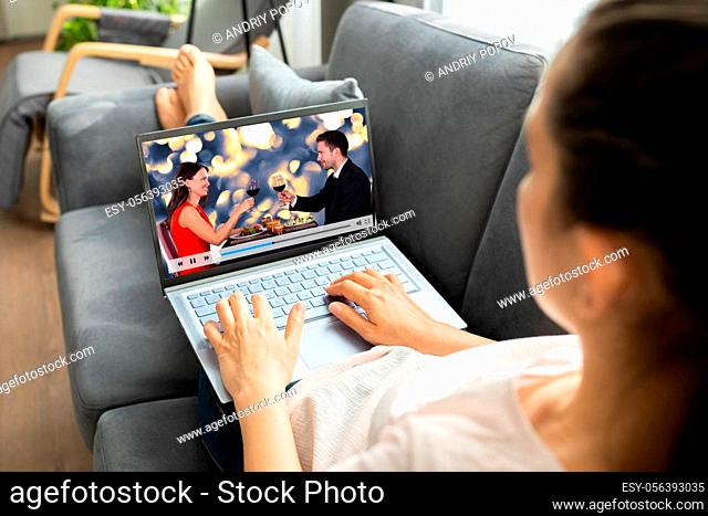 Watching TV Video On Laptop At Sofa Or Couch