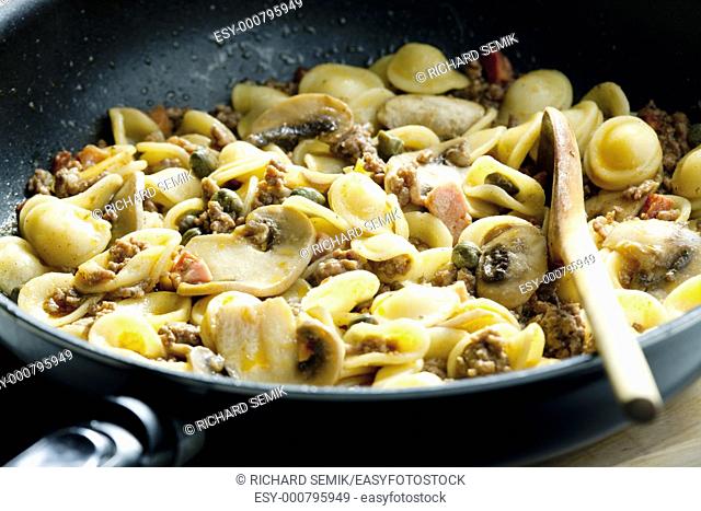 pasta orecchiette with bacon and champignons